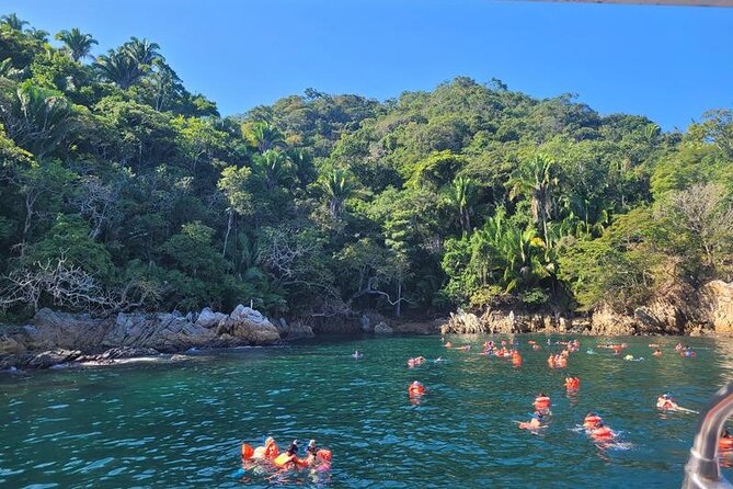 Catamaran Yelapa Beach Tour with Snorkeling, Food and Open Bar - The return to Puerto Vallarta: open bar, games, and a louder boat