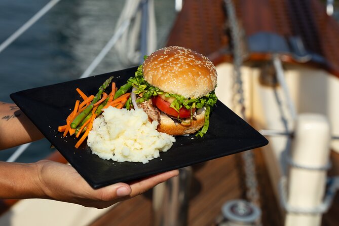 Luxury Puerto Vallarta Shared Sailing Tour: Sail, Swim & Dine - Back toward Puerto Vallarta’s Malecon arches and church