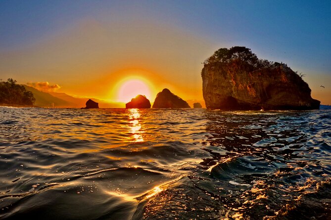 Sunset and Bioluminescence Boat Tour at Los Arcos Islands - Bioluminescent cave snorkeling: how the glow works